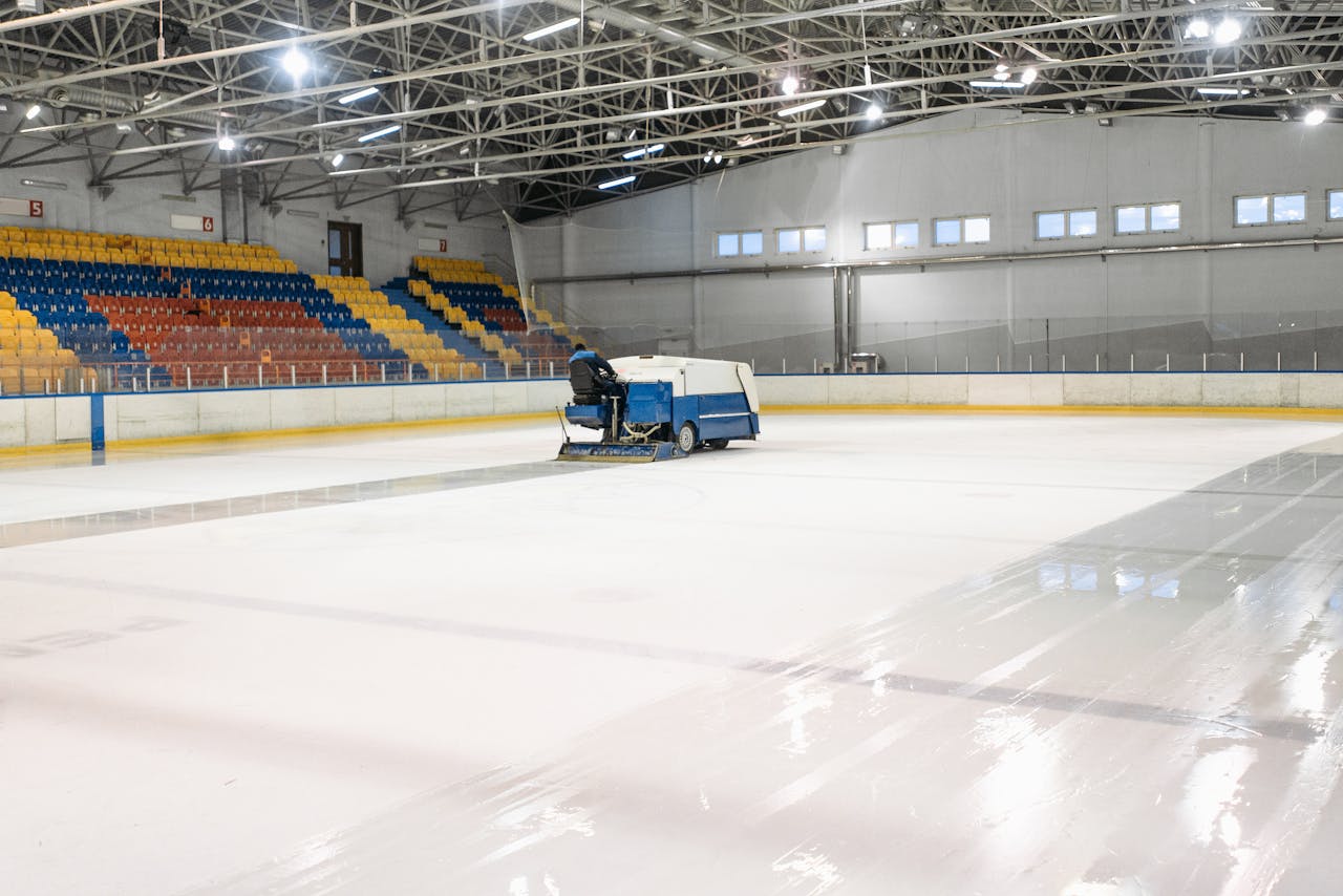 testimonials-img An ice resurfacer smooths the surface of an indoor ice skating rink.